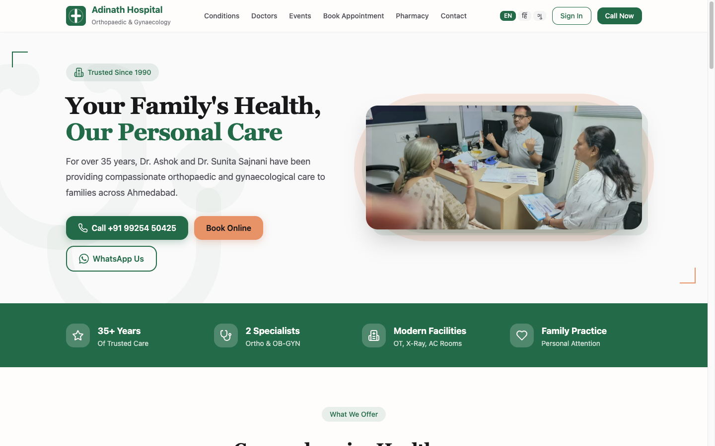 The Adinath homepage in English — warm theme, real doctors, the language switcher top-right.